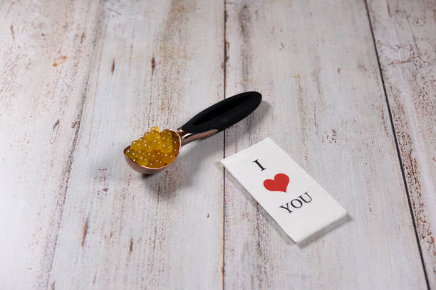 istock Orange balloons in spoon with tissue paper 815699696