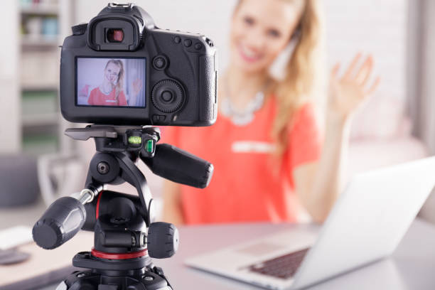 istock Vlogger girl and new video 815716706