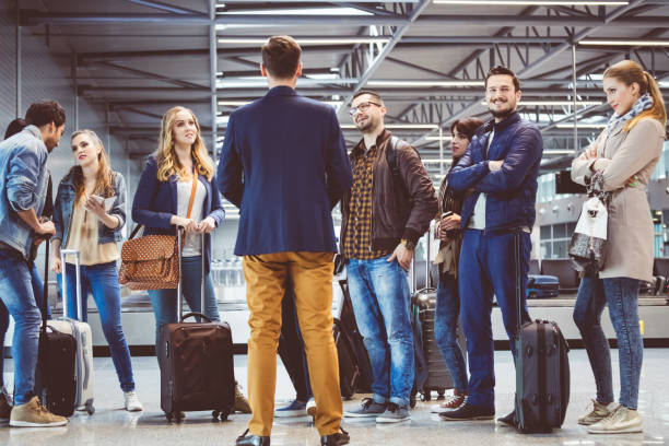 istock Group of passengers standing at airport lounge 815720696