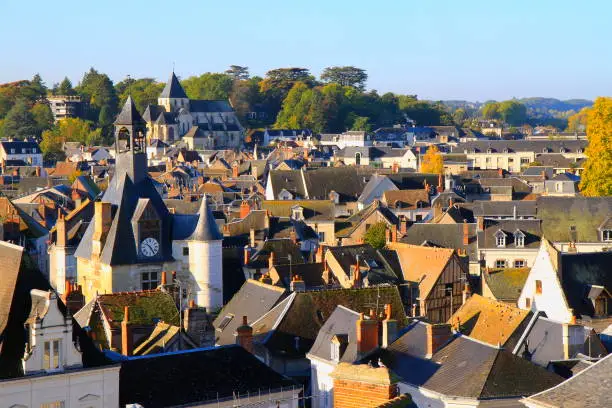 Above Medieval buildings in old town of Amboise, majestic Cityscape and idyllic river Loire reflections at sunrise, Loire Valley, France