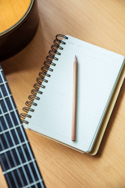 istock Writing song with guitar 815730888