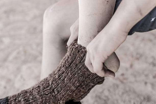 istock Boy in Traditional Handmade Knitted Wool Socks 815738128