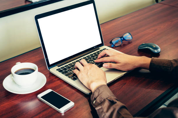 istock Business man using laptop on wood table in office. 815740666