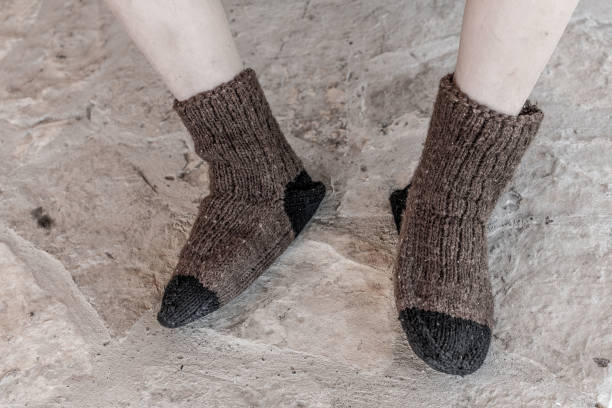 istock Boy in Traditional Handmade Knitted Wool Socks 815740758