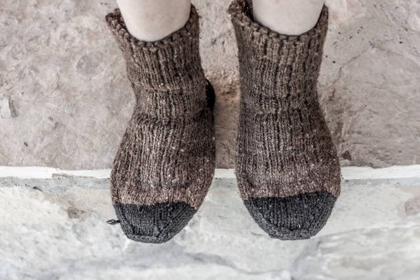 istock Boy in Traditional Handmade Knitted Wool Socks 815740952