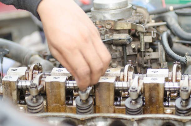 istock Machinists are tuning the valve repair machine. 815743518