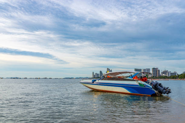 istock Boat and sunset in a beach of Thailand 815751310
