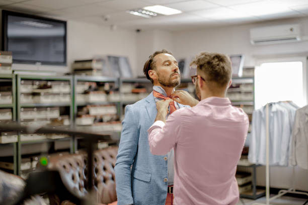 istock A personal stylist helping his customer 815766826
