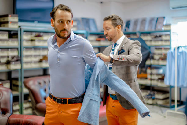 istock A personal stylist helping his customer 815766990