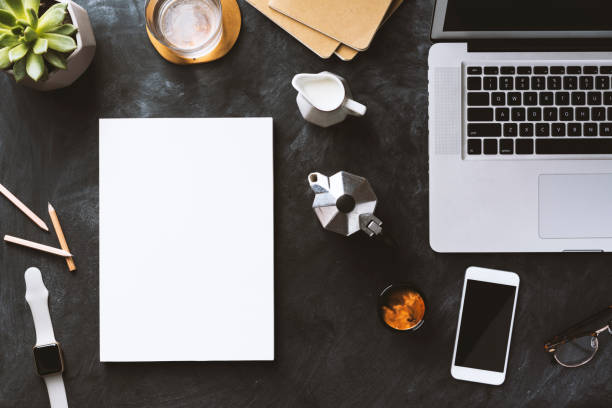 istock Flat lay desktop, white magazine and  smart devices 815767158