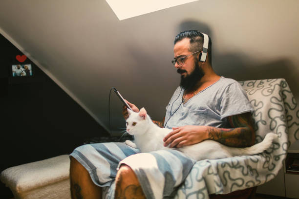 istock Man listening music at home 815767400