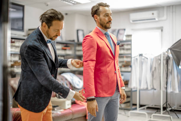 istock A personal stylist helping his customer 815767486
