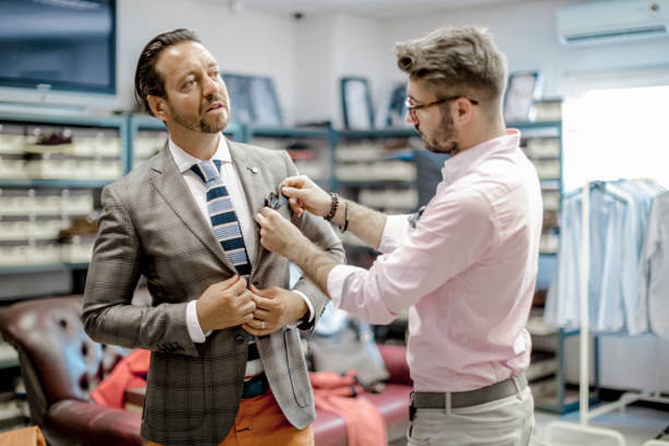 istock A personal stylist helping his customer 815767784