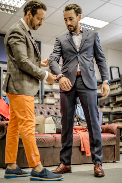 istock A personal stylist helping his customer 815768396