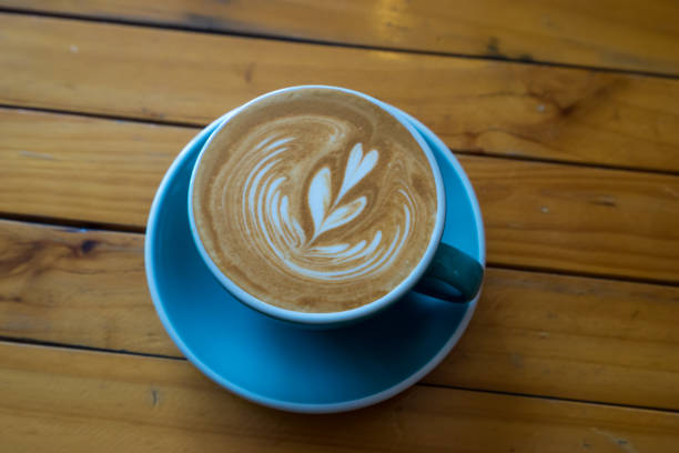 istock coffee latte art  on wood table 815778694