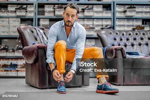 istock Young man shopping shoes 815781482