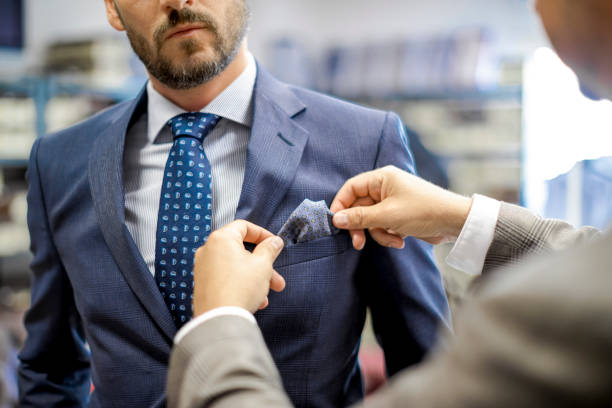 A personal stylist helping his customer