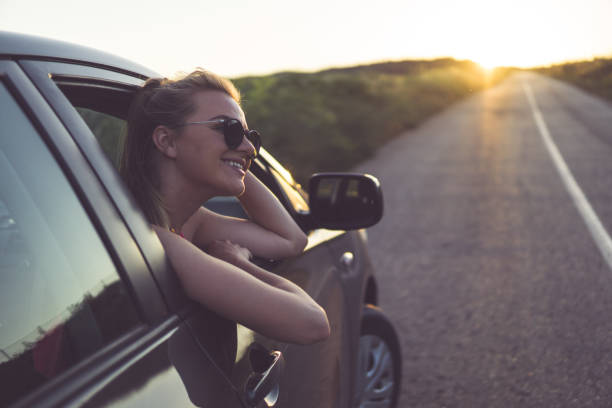 istock Young woman enjoying roadtrip 815782800