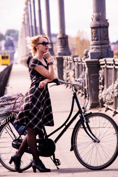 istock girl and retro bike 815782836