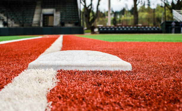 istock Low-Angle View of First Base on Baseball Field 815783628