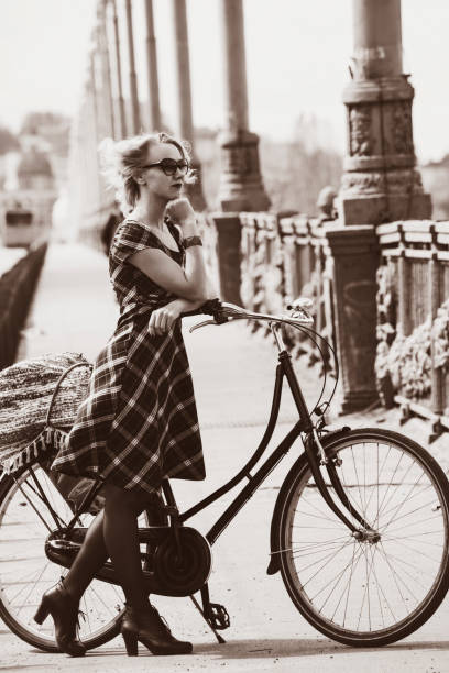 istock girl and retro bike 815783744