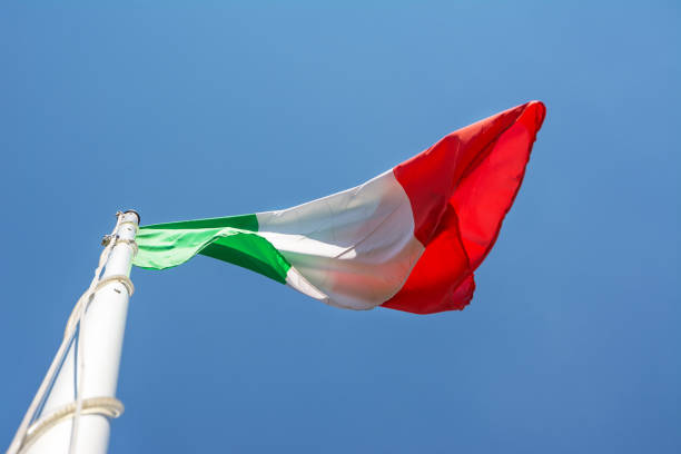 istock The Italian flag in blue sky 815784100