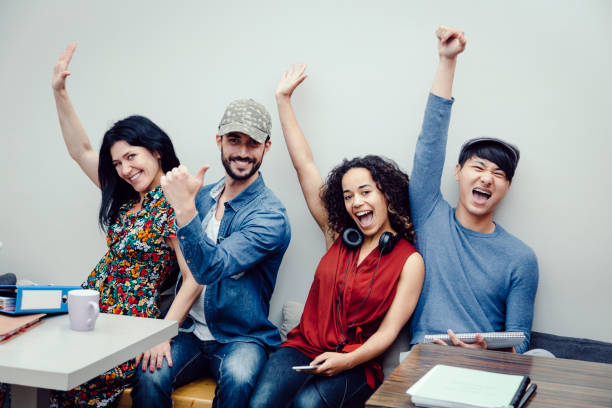 istock Group of four multiethnic entrepreneurs celebrating success 815808618