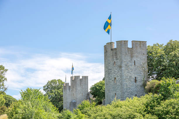 Town Wall in Visby, Gotland Town Wall in Visby, Gotland with the Swedish flags. gotland stock pictures, royalty-free photos & images