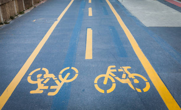 istock Bicycle signs painted on asphalt 815815330