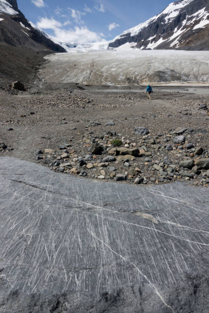 Matanuska Glacier in background with rocky area in foreground, Alaska
