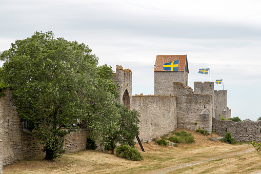Town Wall in Visby, Gotland with the Swedish flags.