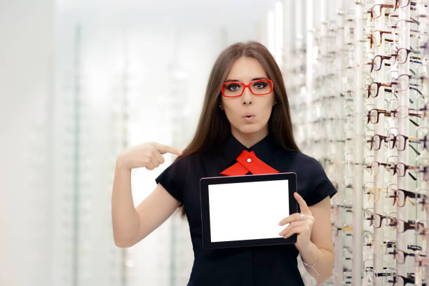 istock Surprised Woman with PC Tablet in Medical Optic Store 815859456