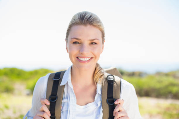 istock Attractive hiking blonde smiling at camera 815872962