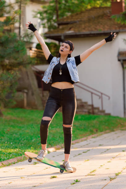 istock AYoung Women on skateboard 815873252