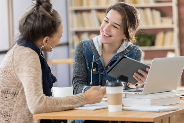 istock College friends use technology in student center 815897914
