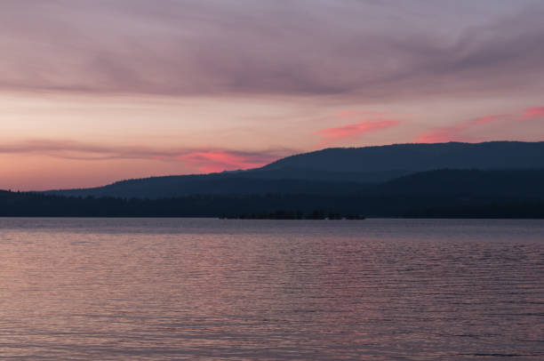 istock Sunset over lake and hills 815901516