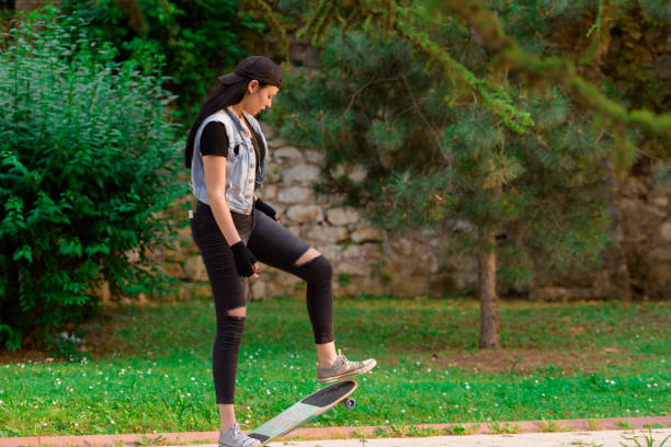 istock Young Woman on skateboard 815907146