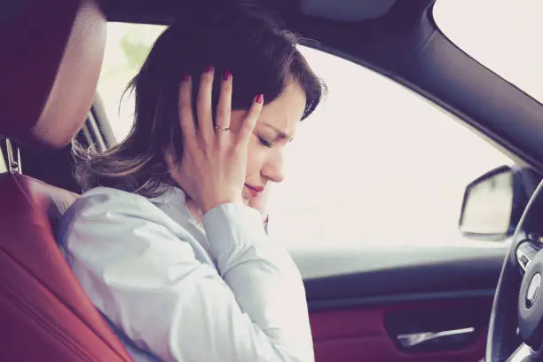 Photo of Stressed woman driver sitting inside her car