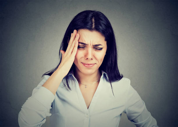 istock Young woman suffering from headache 815910008