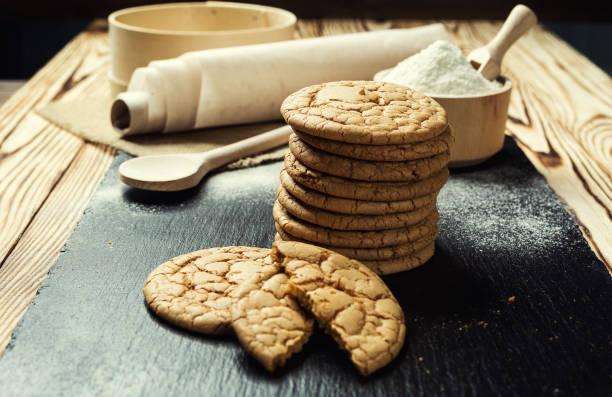 istock Biscuit sweet cookie background. Domestic stacked butter biscuit pattern concept,close up macro.Homemade cookies on wooden table.Cereal biscuits with the sesame,peanuts,sunflower and amaranth. 815915556