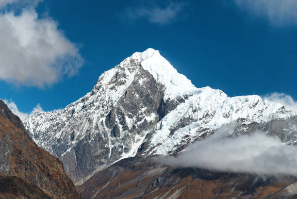 Peaks Of Mountains Covered By Snow Stock Photo - Download Image