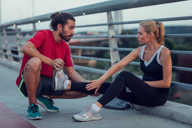 istock Woman Exercising With Personal Trainer Outdoors 815942082