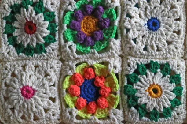 Crochet is a process of creating fabric by interlocking loops of yarn, thread, or strands of other materials using a crochet hook.