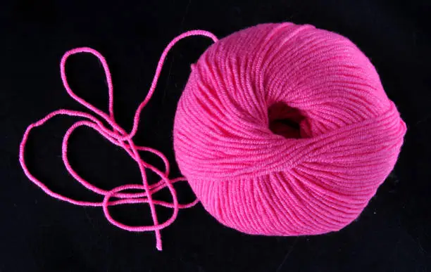 A ball gets its name from the circular ball-like shape of the yarn. Many knitters will roll their yarn from a skein or hank into a ball for ease of use. Rolling skeins that have lost their shape because of how little yarn they have into a ball is an easy way to keep your yarn from tangling as you knit.