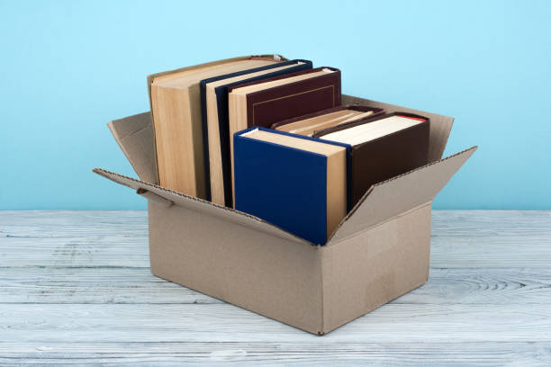 istock Open books on on wooden deck table and blue background. Back to School. Education concept with copy space for your ad text 815957656