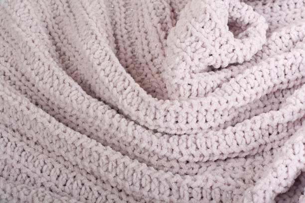 istock Sweater or scarf fabric texture large knitting. Knitted jersey background with a relief pattern. Wool hand- machine, handmade 815958132