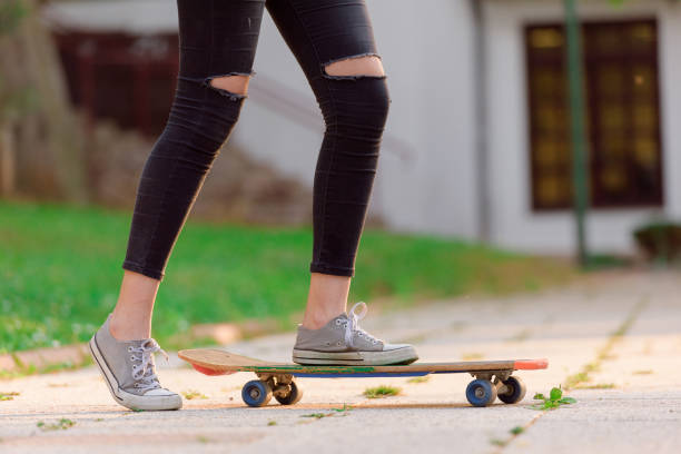 istock Young woman on skateboard - detail 815970144