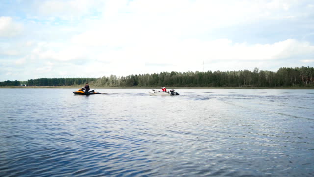 Jet Ski with boat on rope tow