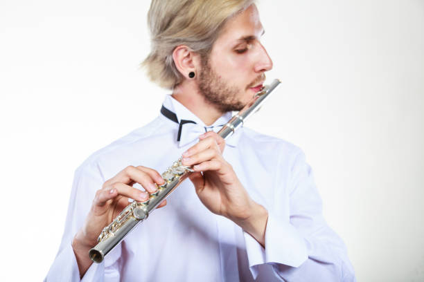 istock Male flutist playing his flute 815988890