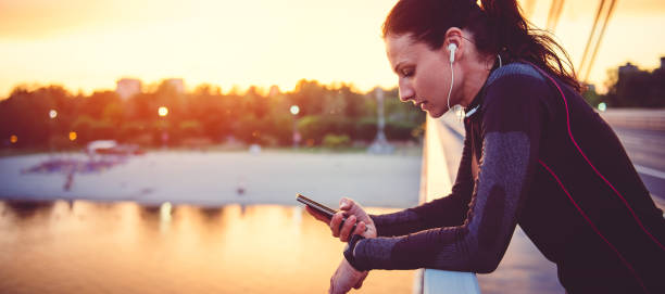 Fitness woman using smart phone